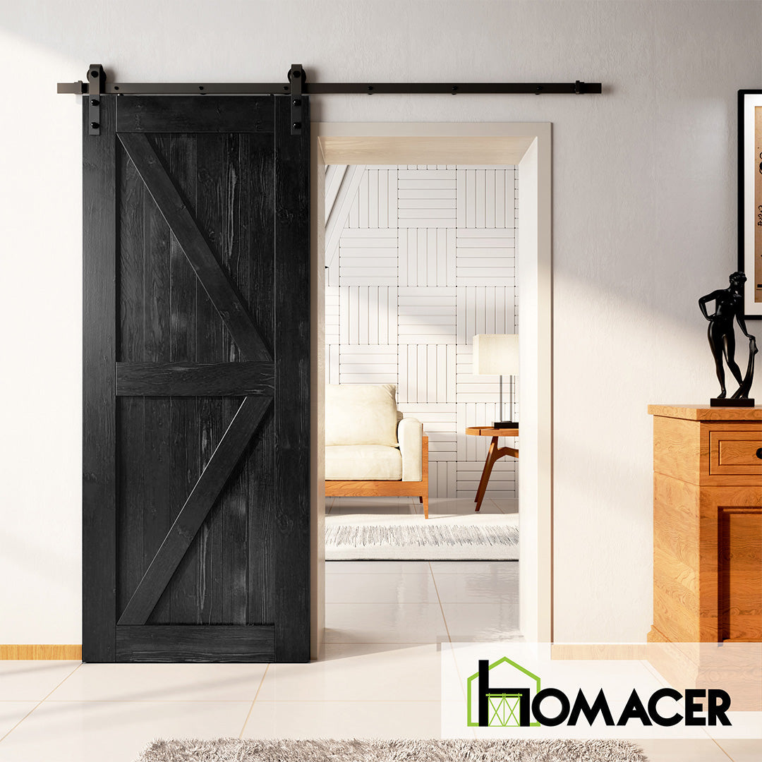 Black barn door with classic X design sliding open into a cozy modern living space – Homacer barn door hardware