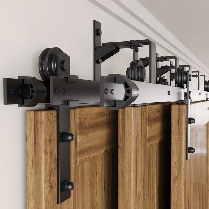 Triple-track bypass system for three overlapping sliding wood barn doors
