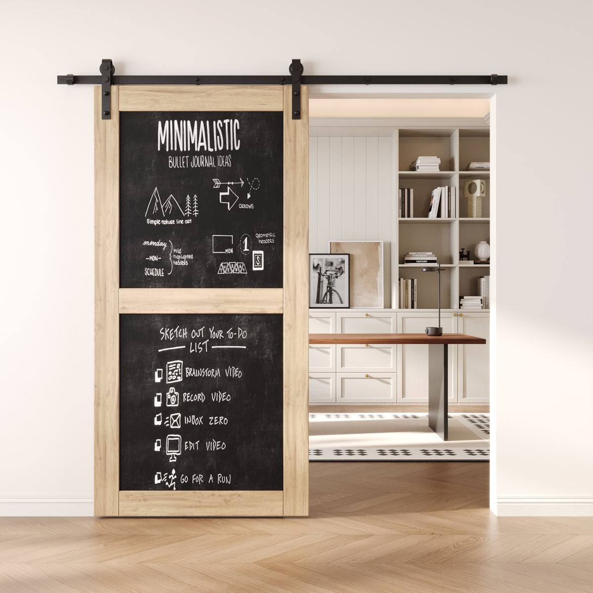 Chalkboard barn door with black sliding hardware in a modern interior