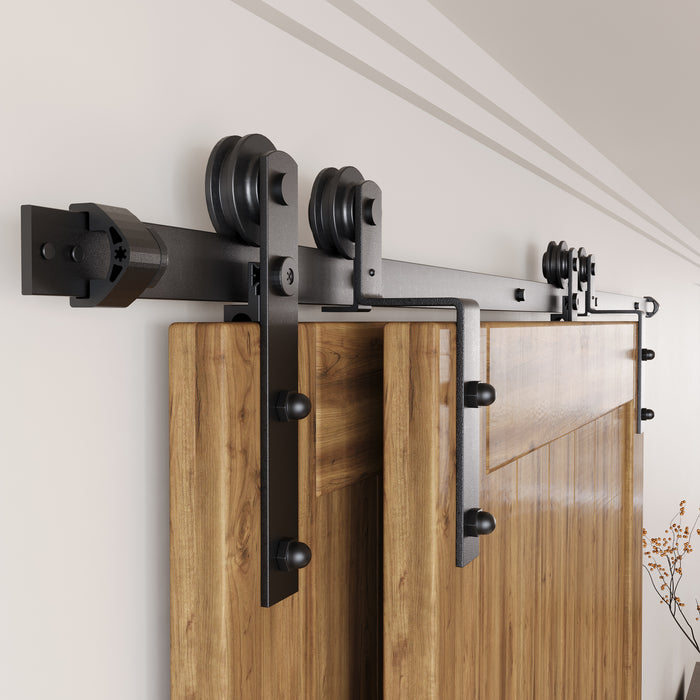Bypass barn door hardware kit with overlapping sliding tracks for limited wall space