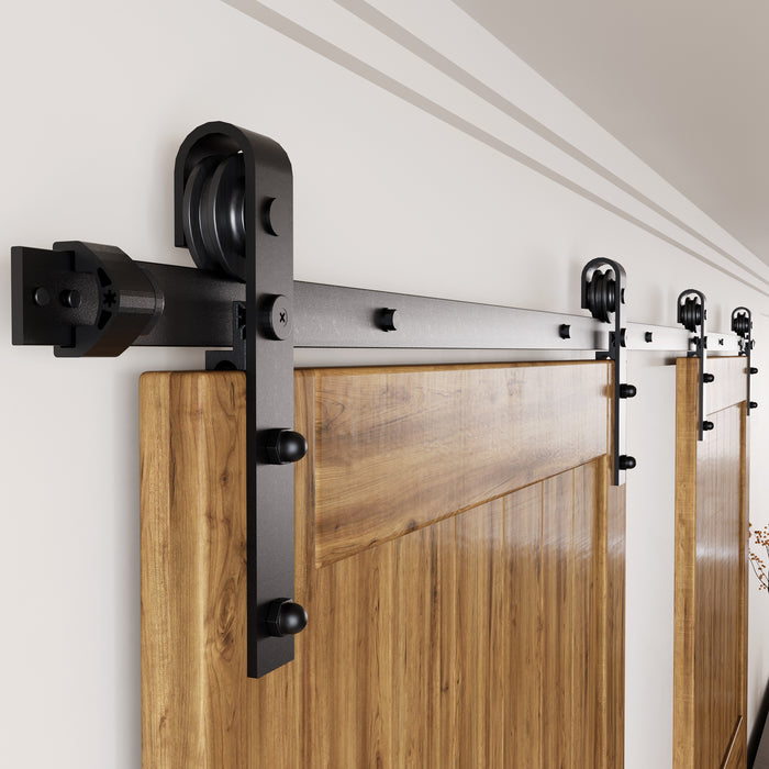 Double barn door hardware kit for two sliding barn doors on a wide interior opening